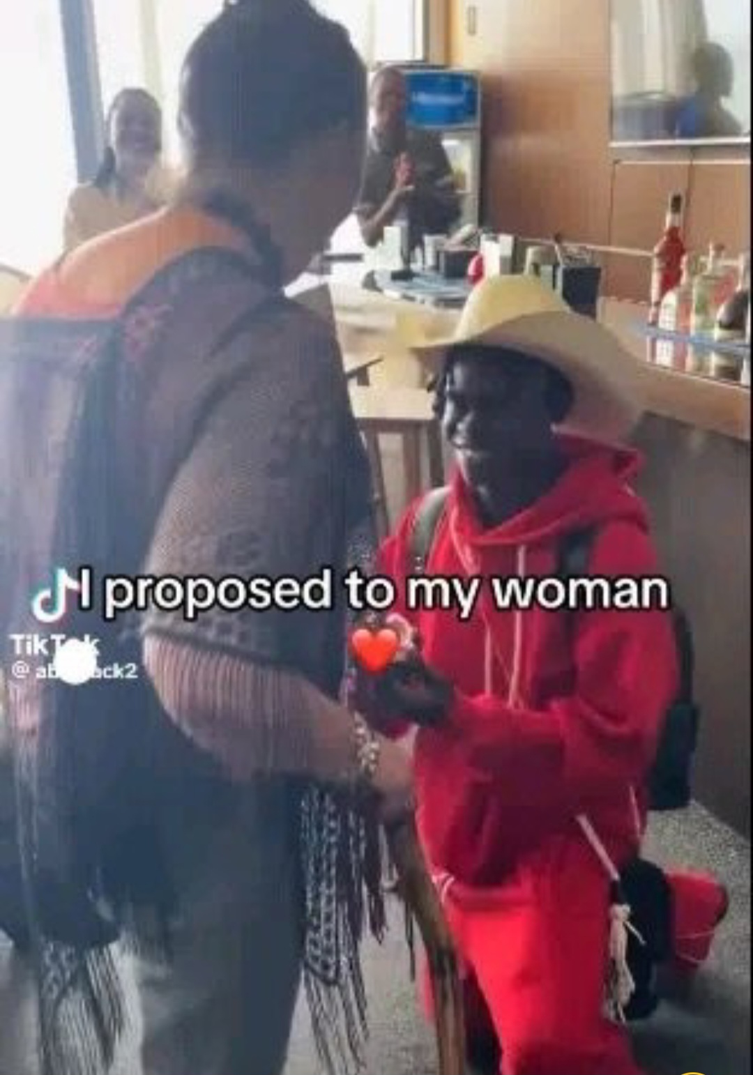 VIDEO: Mixed Reactions As Nigerian Man Proposes To American Lover After She Landed At A Nigerian Airport