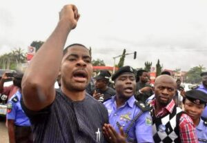 Deji Adeyanju protesting